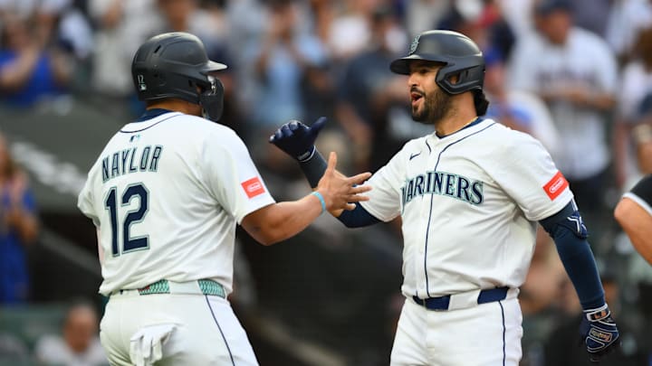 Aug 5, 2025; Seattle, Washington, USA; Seattle Mariners first baseman Josh Naylor (12) and third baseman Eugenio Suarez (28) celebrate after Suarez hit a 2-run home run against the Chicago White Sox during the fourth inning at T-Mobile Park. Mandatory Credit: Steven Bisig-Imagn Images Aug 5, 2025; Seattle, Washington, USA; Seattle Mariners first baseman Josh Naylor (12) and third baseman Eugenio Suarez (28) celebrate after Suarez hit a 2-run home run against the Chicago White Sox during the fourth inning at T-Mobile Park. Mandatory Credit: Steven Bisig-Imagn Images