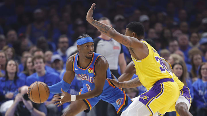 Thunder guard Shai Gilgeous-Alexander is defended by Lakers guard Marcus Smart during Game 1 of the Western Conference semifinals. 