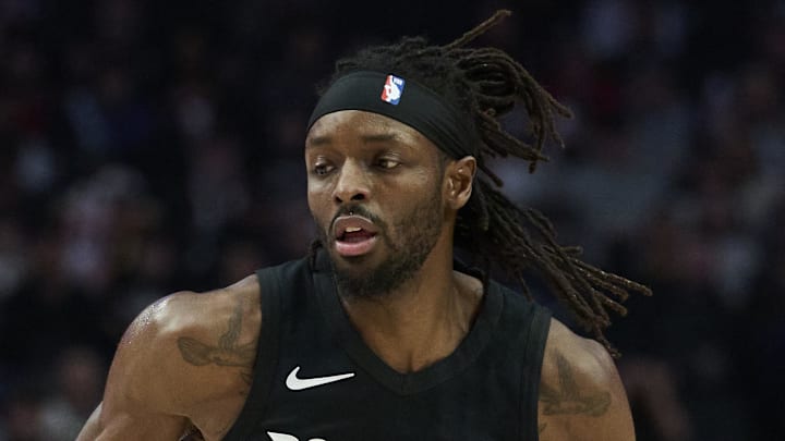 Portland Trail Blazers forward Jerami Grant dribbles the ball against Dallas Mavericks forward P.J. Washington.