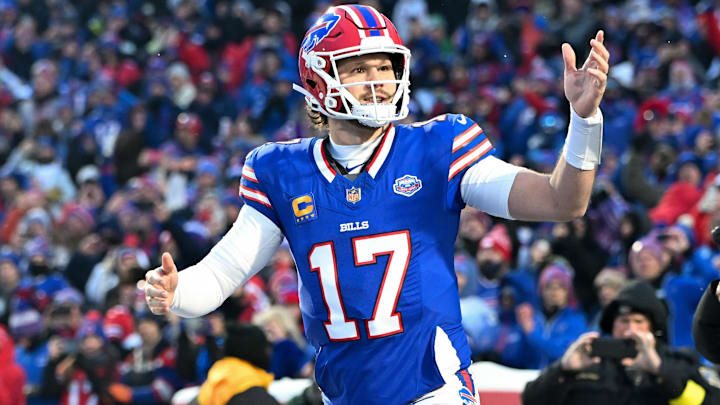 Buffalo Bills quarterback Josh Allen runs onto the field before the game against the New York Jets at Highmark Stadium.
