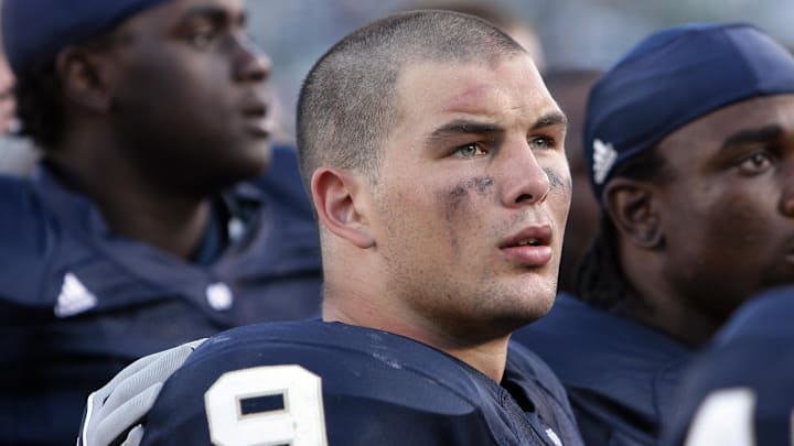 Sep. 1, 2007; South Bend, IN, USA; Notre Dame Fighting Irish defensive back Tom Zbikowski (9) sings the Notre Dame Alma Mater with his teammates after the Georgia Tech Yellow Jackets beat Notre Dame 33-3 at Notre Dame Stadium. 