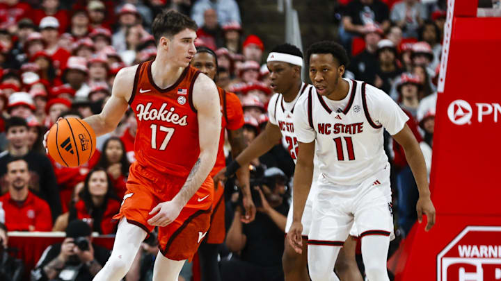 Feb 7, 2026; Raleigh, North Carolina, USA; Virginia Tech Hokies guard Neoklis Avdalas (17) dribbles with the ball guarded by NC State Wolfpack guard Quadir Copeland (11) during the first half of the game at Lenovo Center. Mandatory Credit: Jaylynn Nash-Imagn Images