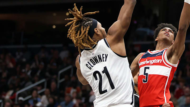 Mar 29, 2025; Washington, District of Columbia, USA; Washington Wizards guard AJ Johnson (5) takes a shot over Brooklyn Nets forward Noah Clowney (21) during the second half at Capital One Arena. Mandatory Credit: Daniel Kucin Jr.-Imagn Images Mar 29, 2025; Washington, District of Columbia, USA; Washington Wizards guard AJ Johnson (5) takes a shot over Brooklyn Nets forward Noah Clowney (21) during the second half at Capital One Arena. Mandatory Credit: Daniel Kucin Jr.-Imagn Images