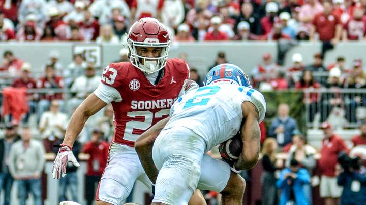 Oklahoma defensive back Eli Bowen prepares to tackle Ole Miss wide receiver Harrison Wallace III. Oklahoma defensive back Eli Bowen prepares to tackle Ole Miss wide receiver Harrison Wallace III.