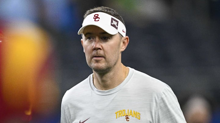 Jan 2, 2023; Arlington, Texas, USA; USC Trojans head coach Lincoln Riley walks the field before the game between the USC Trojans and the Tulane Green Wave in the 2023 Cotton Bowl at AT&T Stadium. Mandatory Credit: Jerome Miron-Imagn Images