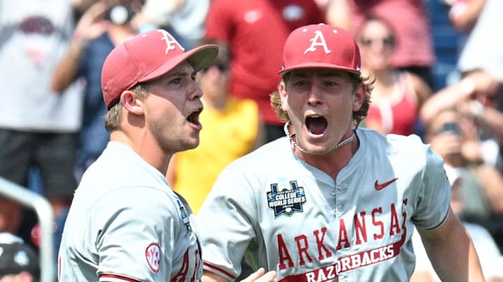 Jun 16, 2025; Omaha, Neb, USA;  Arkansas Razorbacks starting pitcher Gage Wood (14) celebrates with infielder Gabe Fraser (6) after throwing a no hitter against the Murray State Racers at Charles Schwab Field. Mandatory Credit: Steven Branscombe-Imagn Images