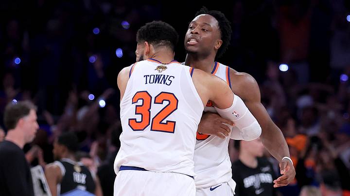 Jun 10, 2026; New York, New York, USA; New York Knicks center Karl-Anthony Towns (32) hugs forward OG Anunoby (8) after Anunoby's go ahead basket late during the fourth quarter of game four of the 2026 NBA Finals against the San Antonio Spurs at Madison Square Garden. Mandatory Credit: Brad Penner-Imagn Images