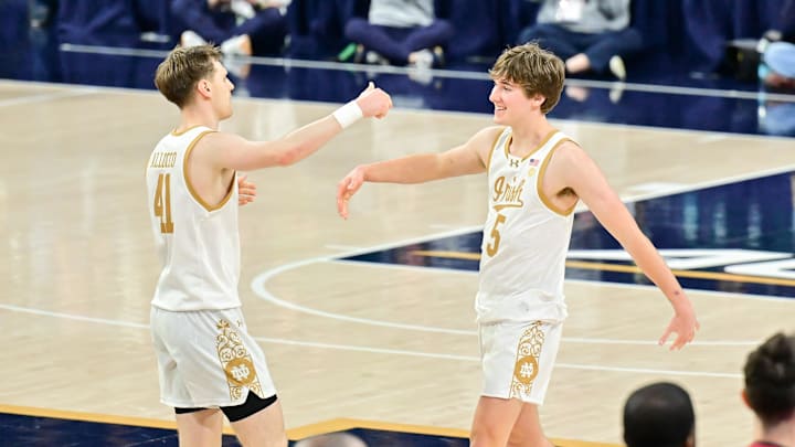 Mar 5, 2025; South Bend, Indiana, USA; Notre Dame Fighting Irish guard Matt Allocco (41) and guard Cole Certa (5) celebrate after Notre Dame defeated the Stanford Cardinal 56-54 at the Purcell Pavilion. Mar 5, 2025; South Bend, Indiana, USA; Notre Dame Fighting Irish guard Matt Allocco (41) and guard Cole Certa (5) celebrate after Notre Dame defeated the Stanford Cardinal 56-54 at the Purcell Pavilion.