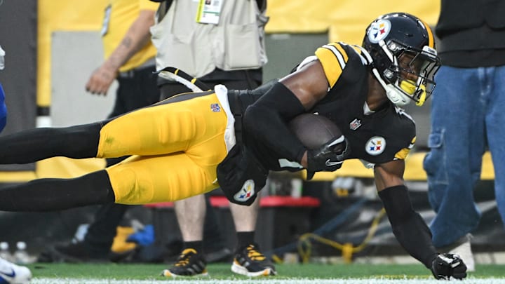 Aug 17, 2024; Pittsburgh, Pennsylvania, USA;  Pittsburgh Steelers wide receiver George Pickens (14) attempts to catch a pass on the sideline against the Buffalo Bills during the first quarter at Acrisure Stadium. Mandatory Credit: Barry Reeger-Imagn Images