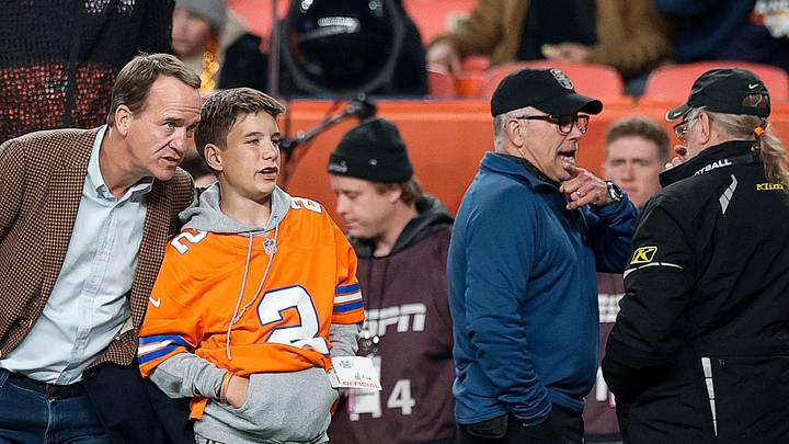 Dec 2, 2024; Denver, Colorado, USA; Former Denver Broncos player Peyton Manning with his son Marshall before the game against the Cleveland Browns at Empower Field at Mile High. Mandatory Credit: Isaiah J. Downing-Imagn Images