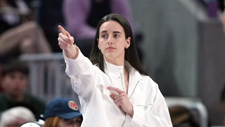 Aug 31, 2025; San Francisco, California, USA; Indiana Fever guard Caitlin Clark (center) gestures after an offensive foul by Golden State Valkyries guard Veronica Burton (foreground right) during the third quarter at Chase Center. Mandatory Credit: Darren Yamashita-Imagn Images