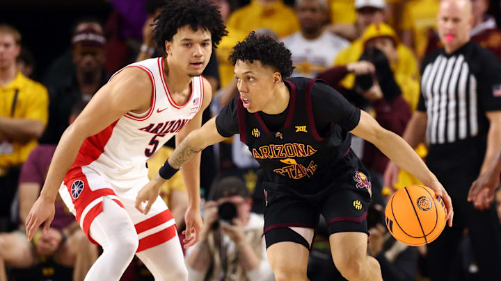 Jan 31, 2026; Tempe, Arizona, USA; Arizona State Sun Devils guard Bryce Ford (4) controls the ball against Arizona Wildcats guard Brayden Burries (5) in the first half at Desert Financial Arena. Mandatory Credit: Mark J. Rebilas-Imagn Images Jan 31, 2026; Tempe, Arizona, USA; Arizona State Sun Devils guard Bryce Ford (4) controls the ball against Arizona Wildcats guard Brayden Burries (5) in the first half at Desert Financial Arena. Mandatory Credit: Mark J. Rebilas-Imagn Images