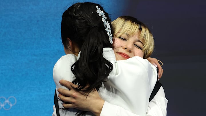 Alysa Liu hugged Japan’s Ami Nakai after her score was announced.