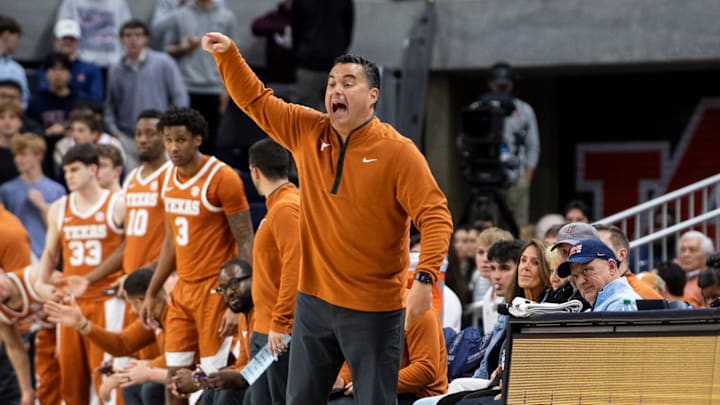 Texas Longhorns head coach Sean Miller talks with his team.