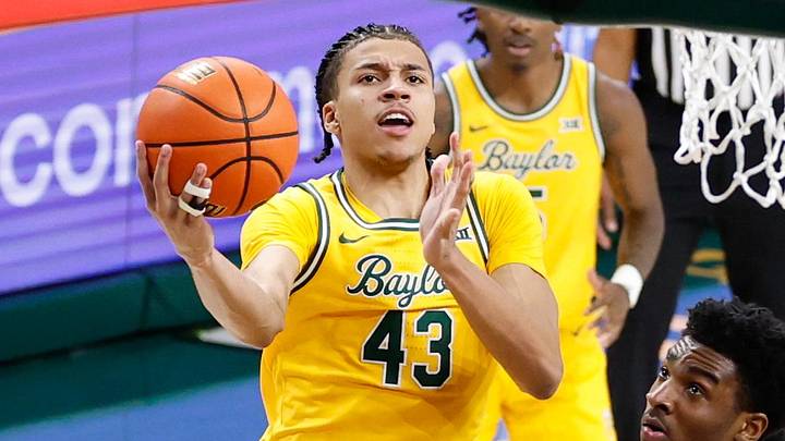 Feb 10, 2026; Waco, Texas, USA; Baylor Bears guard Cameron Carr (43) drives to the basket for a layup past BYU Cougars guard Robert Wright III (1) during the second half at Paul and Alejandra Foster Pavilion. Mandatory Credit: Chris Jones-Imagn Images Feb 10, 2026; Waco, Texas, USA; Baylor Bears guard Cameron Carr (43) drives to the basket for a layup past BYU Cougars guard Robert Wright III (1) during the second half at Paul and Alejandra Foster Pavilion. Mandatory Credit: Chris Jones-Imagn Images