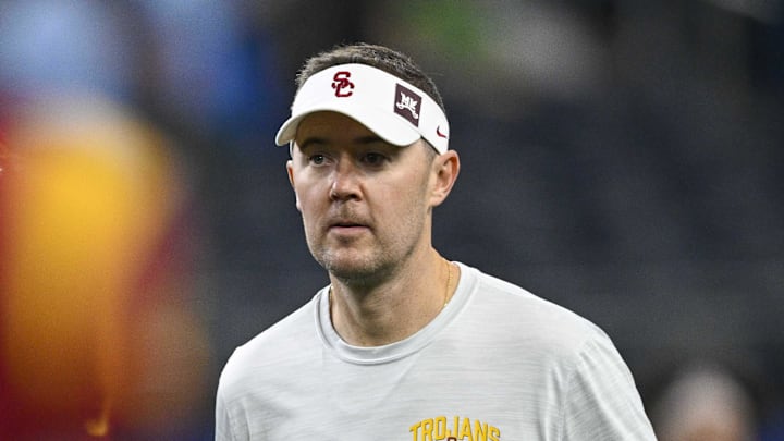 Jan 2, 2023; Arlington, Texas, USA; USC Trojans head coach Lincoln Riley walks the field before the game between the USC Trojans and the Tulane Green Wave in the 2023 Cotton Bowl at AT&T Stadium. Mandatory Credit: Jerome Miron-Imagn Images