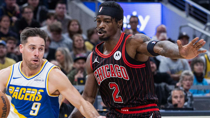 Nov 29, 2025; Indianapolis, Indiana, USA; Indiana Pacers guard T.J. McConnell (9) drives with the ball against Chicago Bulls forward Emanuel Miller (2) during the second half at Gainbridge Fieldhouse. Mandatory Credit: Trevor Ruszkowski-Imagn Images