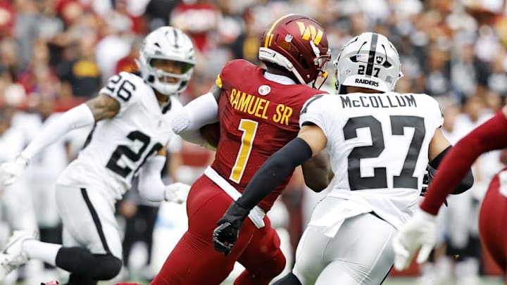 Sep 21, 2025; Landover, Maryland, USA; Washington Commanders wide receiver Deebo Samuel Sr. (1) returns the opening kickoff during the first half against the Las Vegas Raiders at Northwest Stadium. Mandatory Credit: Geoff Burke-Imagn Images