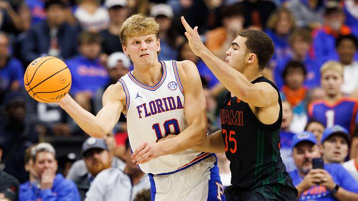 Nov 16, 2025; Gainesville, Florida, USA; Florida Gators forward Thomas Haugh (10) passes the ball while Miami Hurricanes guard Dante Allen (35) defends during the second half at VyStar Veterans Memorial Arena. Mandatory Credit: Matt Pendleton-Imagn Images Nov 16, 2025; Gainesville, Florida, USA; Florida Gators forward Thomas Haugh (10) passes the ball while Miami Hurricanes guard Dante Allen (35) defends during the second half at VyStar Veterans Memorial Arena. Mandatory Credit: Matt Pendleton-Imagn Images