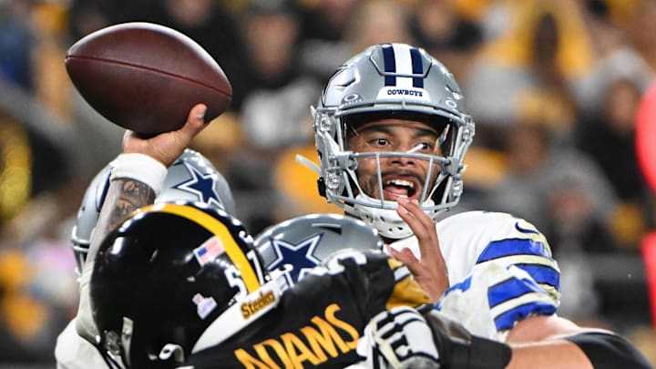 Dallas Cowboys quarterback Dak Prescott (4) l throws a pass while being pressured by Pittsburgh Steelers defensive tackle Montravius Adams (57) during the second quarter at Acrisure Stadium. Dallas Cowboys quarterback Dak Prescott (4) l throws a pass while being pressured by Pittsburgh Steelers defensive tackle Montravius Adams (57) during the second quarter at Acrisure Stadium.