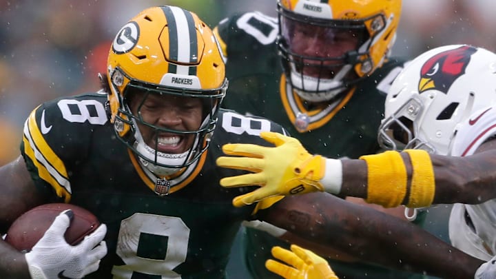 Green Bay Packers running back Josh Jacobs (8) rushes against the Arizona Cardinals last season. Green Bay Packers running back Josh Jacobs (8) rushes against the Arizona Cardinals last season.
