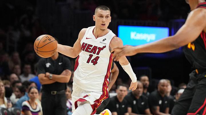 Apr 12, 2026; Miami, Florida, USA;  Miami Heat guard Tyler Herro (14) dribbles against Atlanta Hawks forward Asa Newell (14) during the second half at Kaseya Center. Mandatory Credit: Jim Rassol-Imagn Images