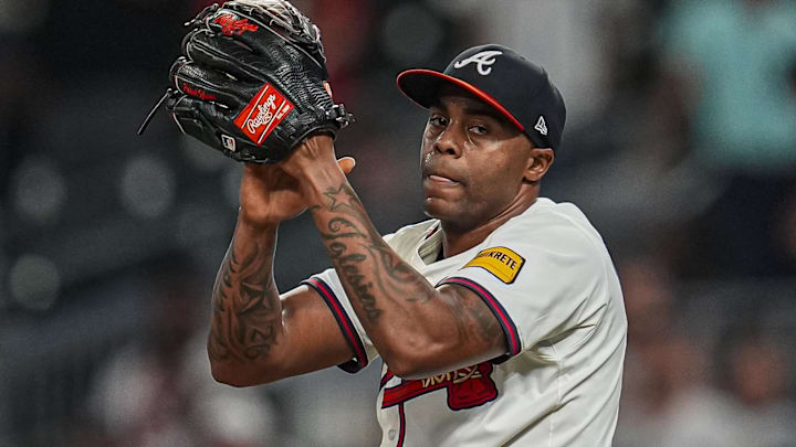 Sep 23, 2025; Cumberland, Georgia, USA; Atlanta Braves relief pitcher Raisel Iglesias (26)  reacts after the Braves defeated the Washington Nationals at Truist Park.