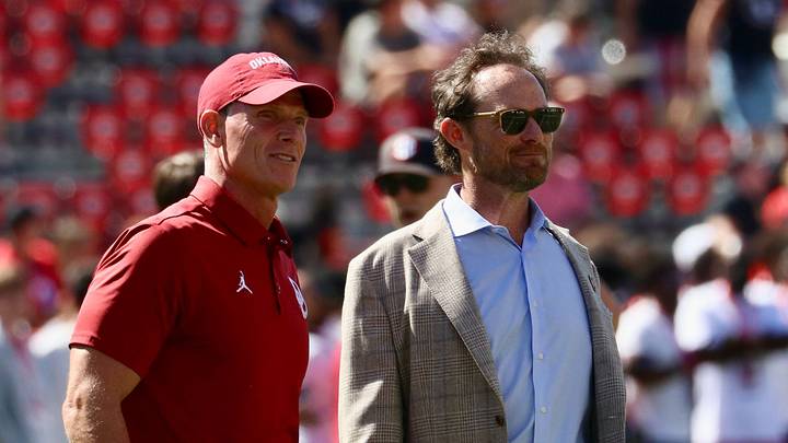 Oklahoma coach Brent Venables and general manager Jim Nagy stand on the field before facing Georgia.