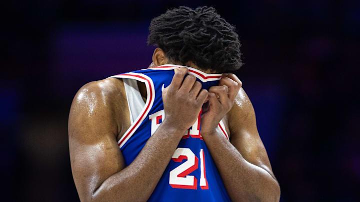 Feb 20, 2025; Philadelphia, Pennsylvania, USA; Philadelphia 76ers center Joel Embiid (21) wipes his face during a break in the third quarter against the Boston Celtics at Wells Fargo Center. Mandatory Credit: Bill Streicher-Imagn Images