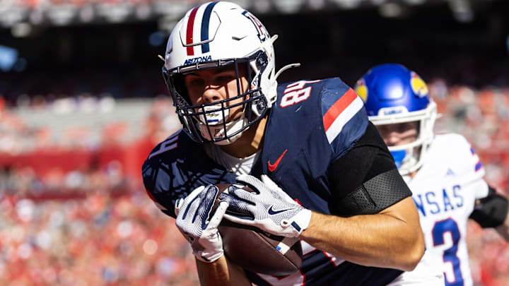 Nov 8, 2025; Tucson, Arizona, USA; Arizona Wildcats tight end Sam Olson (84) catches a touchdown pass against the Kansas Jayhawks in the first half at Arizona Stadium. Mandatory Credit: Mark J. Rebilas-Imagn Images