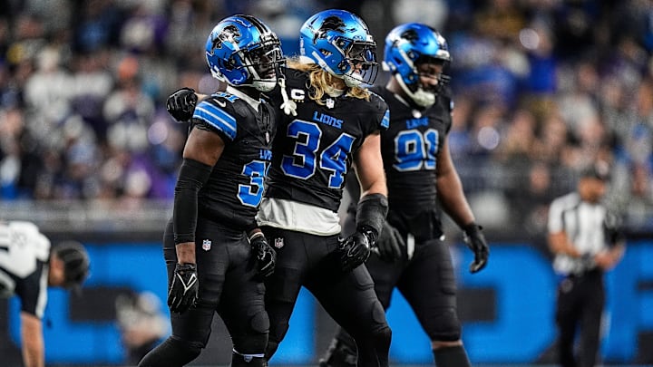 Detroit Lions safety Kerby Joseph (31), linebacker Alex Anzalone (34) walk off the field 