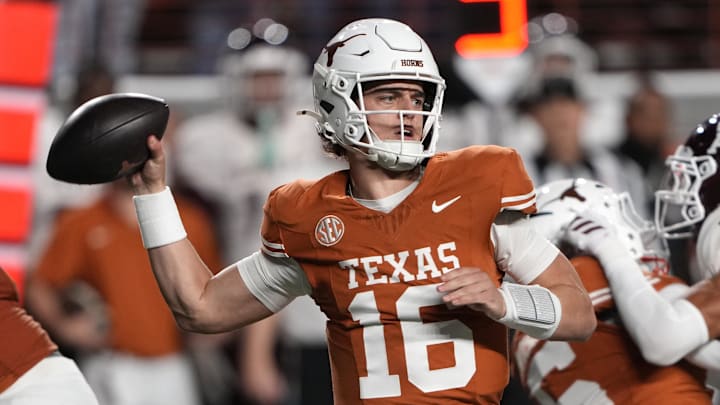 Texas Longhorns quarterback Arch Manning throws a pass during the first half against the Texas A&M Aggies Texas Longhorns quarterback Arch Manning throws a pass during the first half against the Texas A&M Aggies