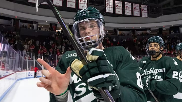 No. 3 Michigan State hockey players skate off the ice celebrating their sweep at No. 1 Boston University on Oct. 18, 2025. No. 3 Michigan State hockey players skate off the ice celebrating their sweep at No. 1 Boston University on Oct. 18, 2025.