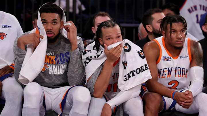 Jan 10, 2025; New York, New York, USA; New York Knicks center Karl-Anthony Towns (32) and guards Jalen Brunson (11) and Miles McBride (2) watch from the bench during the fourth quarter against the Oklahoma City Thunder at Madison Square Garden. Mandatory Credit: Brad Penner-Imagn Images