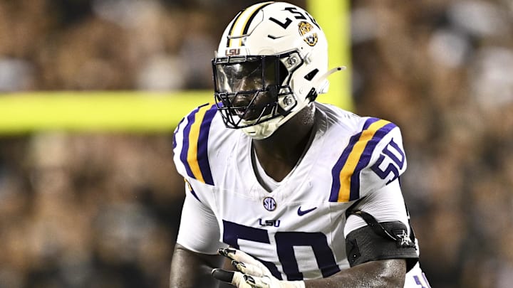 Oct 26, 2024; College Station, Texas, USA; LSU Tigers offensive lineman Emery Jones Jr. (50) lines up during the second quarter against the Texas A&M Aggies. The Aggies defeated the Tigers 38-23; at Kyle Field. Mandatory Credit: Maria Lysaker-Imagn Images. Oct 26, 2024; College Station, Texas, USA; LSU Tigers offensive lineman Emery Jones Jr. (50) lines up during the second quarter against the Texas A&M Aggies. The Aggies defeated the Tigers 38-23; at Kyle Field. Mandatory Credit: Maria Lysaker-Imagn Images.