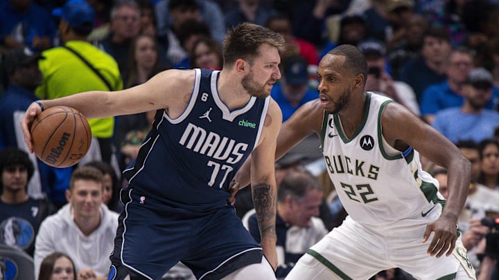 Dec 9, 2022; Dallas, Texas, USA; Dallas Mavericks guard Luka Doncic (77) and Milwaukee Bucks forward Khris Middleton (22) In action during the game between the Dallas Mavericks and the Milwaukee Bucks at the American Airlines Center. Mandatory Credit: Jerome Miron-Imagn Images