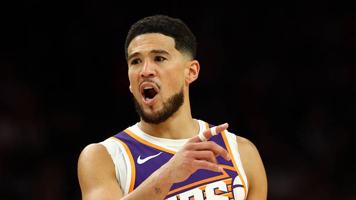 Phoenix, Arizona, USA; Phoenix Suns guard Devin Booker (1) reacts against the Denver Nuggets in the first half at Mortgage Matchup Center on Mar 24, 2026.
