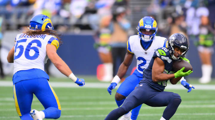 Nov 3, 2024; Seattle, Washington, USA; Seattle Seahawks wide receiver Tyler Lockett (16) catches a pass against the Los Angeles Rams during the first half at Lumen Field. Mandatory Credit: Steven Bisig-Imagn Images