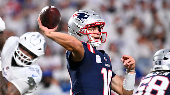 Oct 5, 2025; Orchard Park, New York, USA; New England Patriots quarterback Drake Maye (10) drops back to pass against the Buffalo Bills during the first half at Highmark Stadium. Mandatory Credit: Mark Konezny-Imagn Images