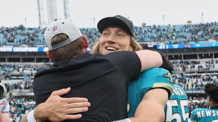 Jan 4, 2026; Jacksonville, Florida, USA; Jacksonville Jaguars quarterback Trevor Lawrence (16) celebrates with head coach Liam Coen (obscured) after the game against the Tennessee Titans at EverBank Stadium. Mandatory Credit: Morgan Tencza-Imagn Images Jan 4, 2026; Jacksonville, Florida, USA; Jacksonville Jaguars quarterback Trevor Lawrence (16) celebrates with head coach Liam Coen (obscured) after the game against the Tennessee Titans at EverBank Stadium. Mandatory Credit: Morgan Tencza-Imagn Images