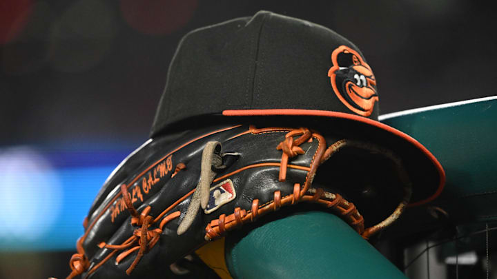 May 8, 2024; Washington, District of Columbia, USA; A Baltimore Orioles hat and glove rest on the dugout rail during a game against the Washington Nationals at Nationals Park. May 8, 2024; Washington, District of Columbia, USA; A Baltimore Orioles hat and glove rest on the dugout rail during a game against the Washington Nationals at Nationals Park.