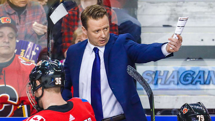 Apr 3, 2018; Calgary, Alberta, CAN; Calgary Flames head coach Glen Gulutzan on his bench against the Arizona Coyotes during the first period at Scotiabank Saddledome. Mandatory Credit: Sergei Belski-Imagn Images