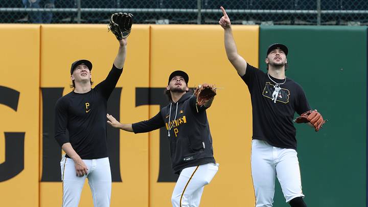 Pirates starting pitchers Bubba Chandler (left), Jared Jones (middle) and Paul Skenes (right) shag flies in the outfield during batting practice. Pirates starting pitchers Bubba Chandler (left), Jared Jones (middle) and Paul Skenes (right) shag flies in the outfield during batting practice.