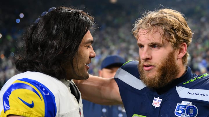 Jan 25, 2026; Seattle, WA, USA; Seattle Seahawks wide receiver Cooper Kupp (10) and Los Angeles Rams wide receiver Puka Nacua (12) talk after the 2026 NFC Championship Game at Lumen Field. Mandatory Credit: Steven Bisig-Imagn Images