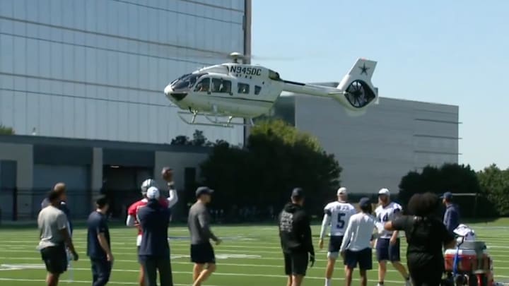 Dallas Cowboys owner Jerry Jones arrives at the team's practice facility in a helicopter. 