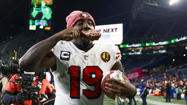 San Francisco 49ers wide receiver Deebo Samuel (19) eats a turkey leg as he jogs to the locker room following a 31-13 victory against the Seattle Seahawks at Lumen Field. Mandatory Credit: Joe Nicholson-Imagn Images
