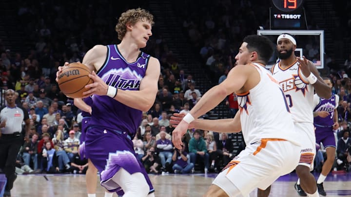 Oct 27, 2025; Salt Lake City, Utah, USA; Utah Jazz forward Lauri Markkanen (23) moves the ball against Phoenix Suns guard Devin Booker (1) during the second half at Delta Center. Mandatory Credit: Rob Gray-Imagn Images Oct 27, 2025; Salt Lake City, Utah, USA; Utah Jazz forward Lauri Markkanen (23) moves the ball against Phoenix Suns guard Devin Booker (1) during the second half at Delta Center. Mandatory Credit: Rob Gray-Imagn Images