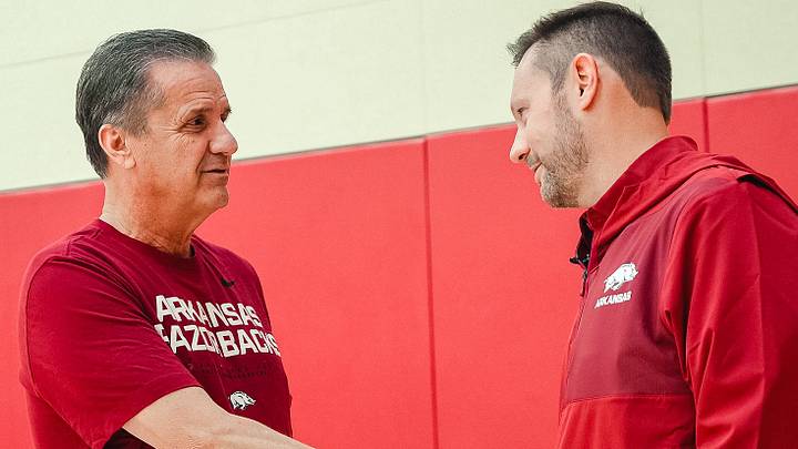 Arkansas basketball coach John Calipari shakes hands with football coach Ryan Silverfield. Arkansas basketball coach John Calipari shakes hands with football coach Ryan Silverfield.