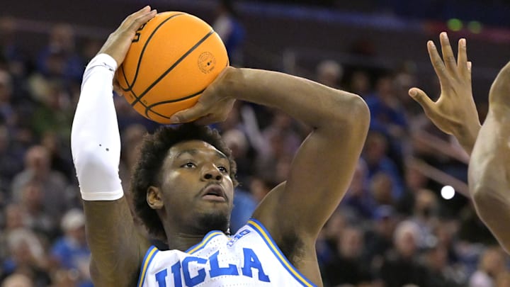 Feb 4, 2025; Los Angeles, California, USA; UCLA Bruins guard Eric Dailey Jr. (3) shoots over Michigan State Spartans forward Coen Carr (55) in the first half at Pauley Pavilion presented by Wescom. Mandatory Credit: Jayne Kamin-Oncea-Imagn Images