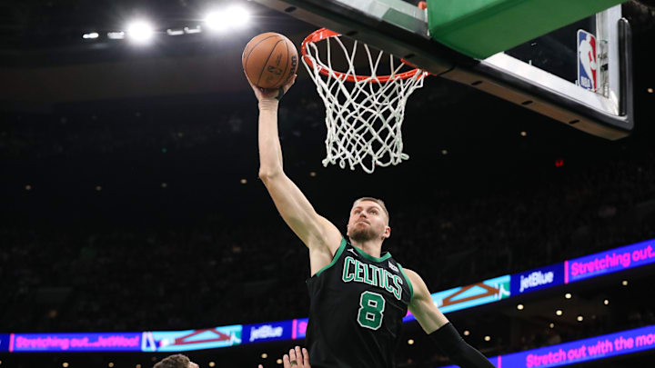 Nov 22, 2023; Boston, Massachusetts, USA; Boston Celtics center Kristaps Porzingis (8) dunks the ball vs. the Milwaukee Bucks.